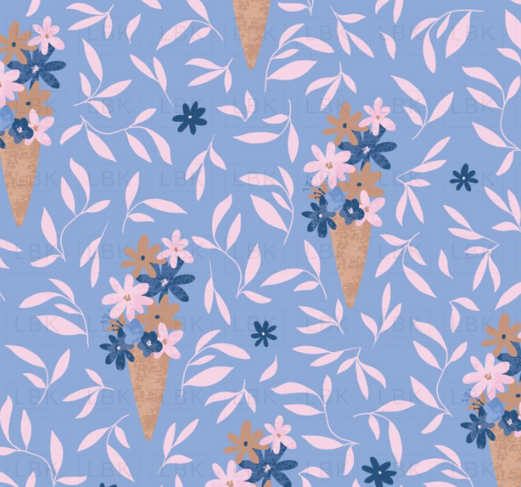 Flowers In Ice Cream Cone On Light Blue